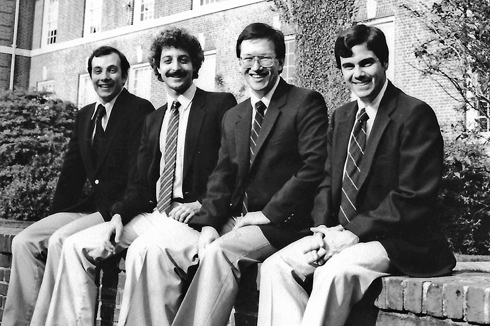Tom Connor (Gilman ‘77), Jerry Marcus (‘77), Jari Villanueva and Brian Goodman (‘75) outside Gilman.